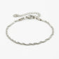 Gedraaide schakelarmband zilverkleurig