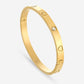 Bangle steentjes en hartjes goudkleurig