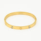 Bangle steentjes en hartjes goudkleurig