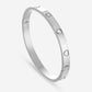 Bangle steentjes en hartjes zilverkleurig
