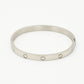 Bangle steentjes en hartjes zilverkleurig