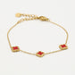 Armband klavers rood goudkleurig