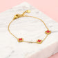 Armband klavers rood goudkleurig