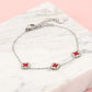 Armband klavers rood zilverkleurig