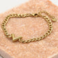 Schakelarmband V goudkleurig