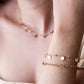 Bead bracelet with gold-colored coins