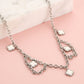 Schakelketting klavers wit zilverkleurig