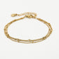 Armband goudkleurig bolletjes drielaags