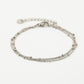 Armband zilverkleurig bolletjes drielaags