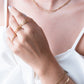 Armband goudkleurig bolletjes drielaags