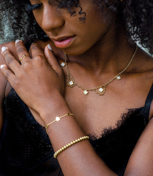 Schakelketting klavers wit goudkleurig