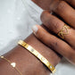 Bangle steentjes en hartjes goudkleurig