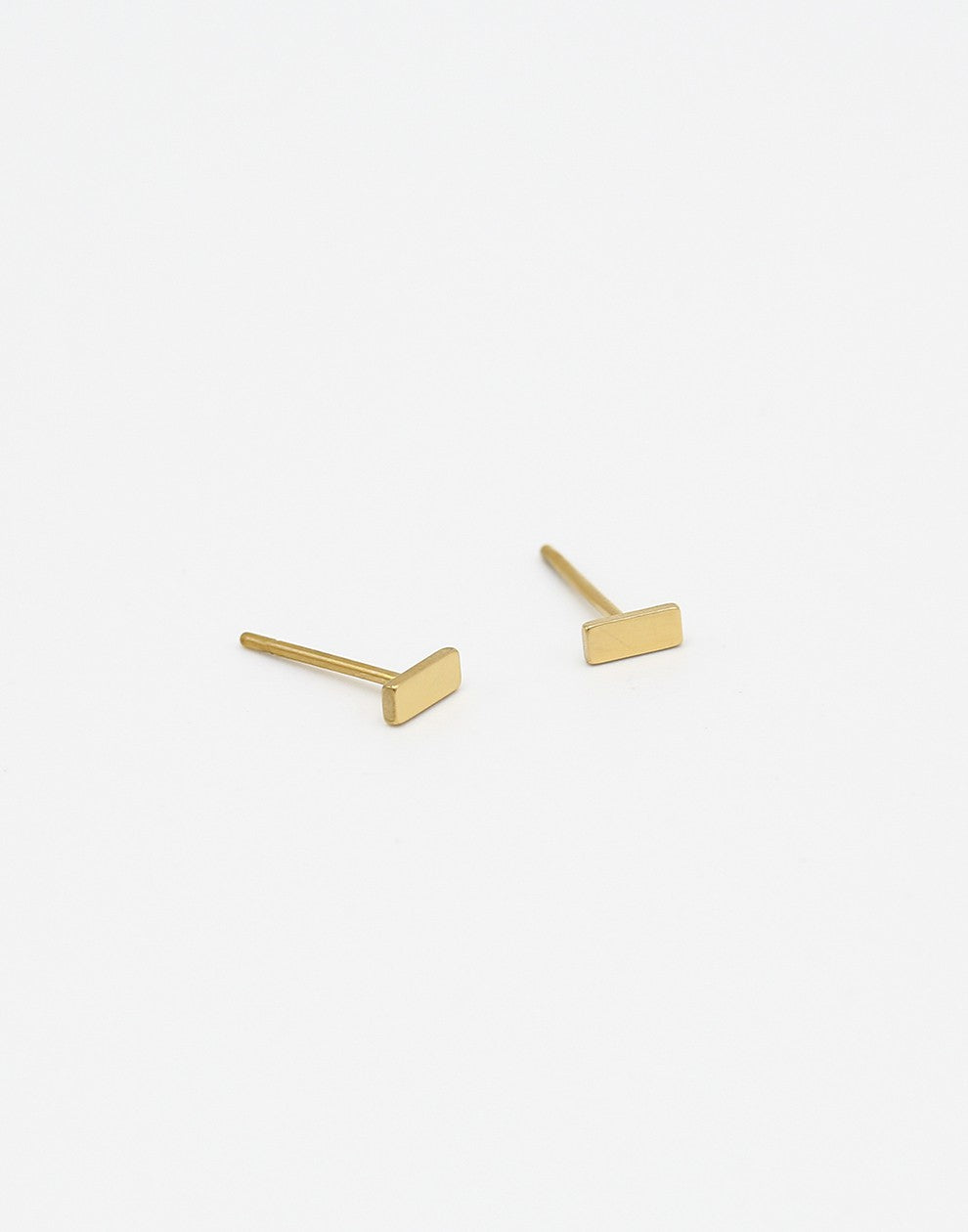 Gold-colored stud bar