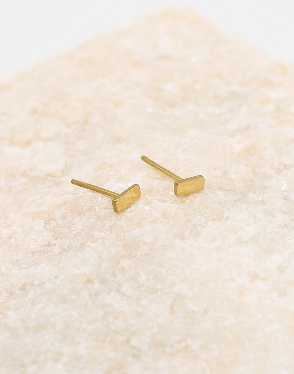 Gold-colored stud bar