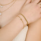 armband verbonden hartjes goudkleurig