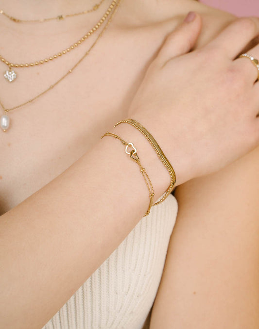 armband verbonden hartjes goudkleurig