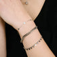 Twisted bracelet with silver-colored coins