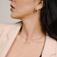 Gold-colored open clover necklace