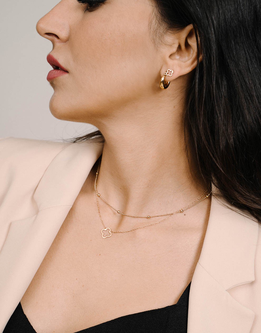 Gold-colored open clover necklace