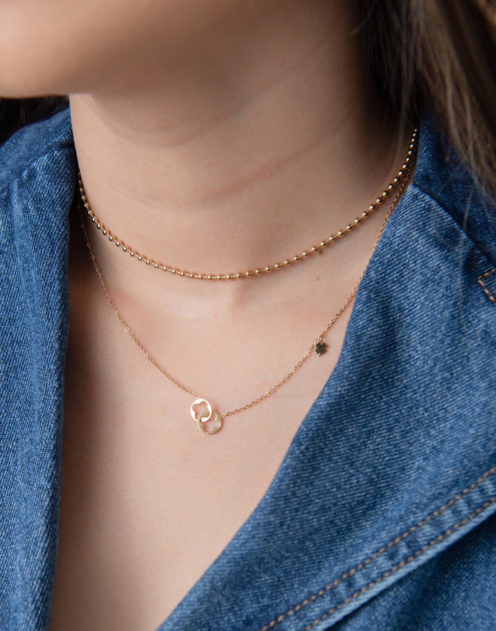 Ketting dubbele klavertjes connected goudkleurig