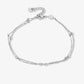 Ankle bracelet with double silver-colored beads and chains