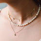 ketting hangende symbolen goudkleurig