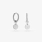 silver-colored coin earrings
