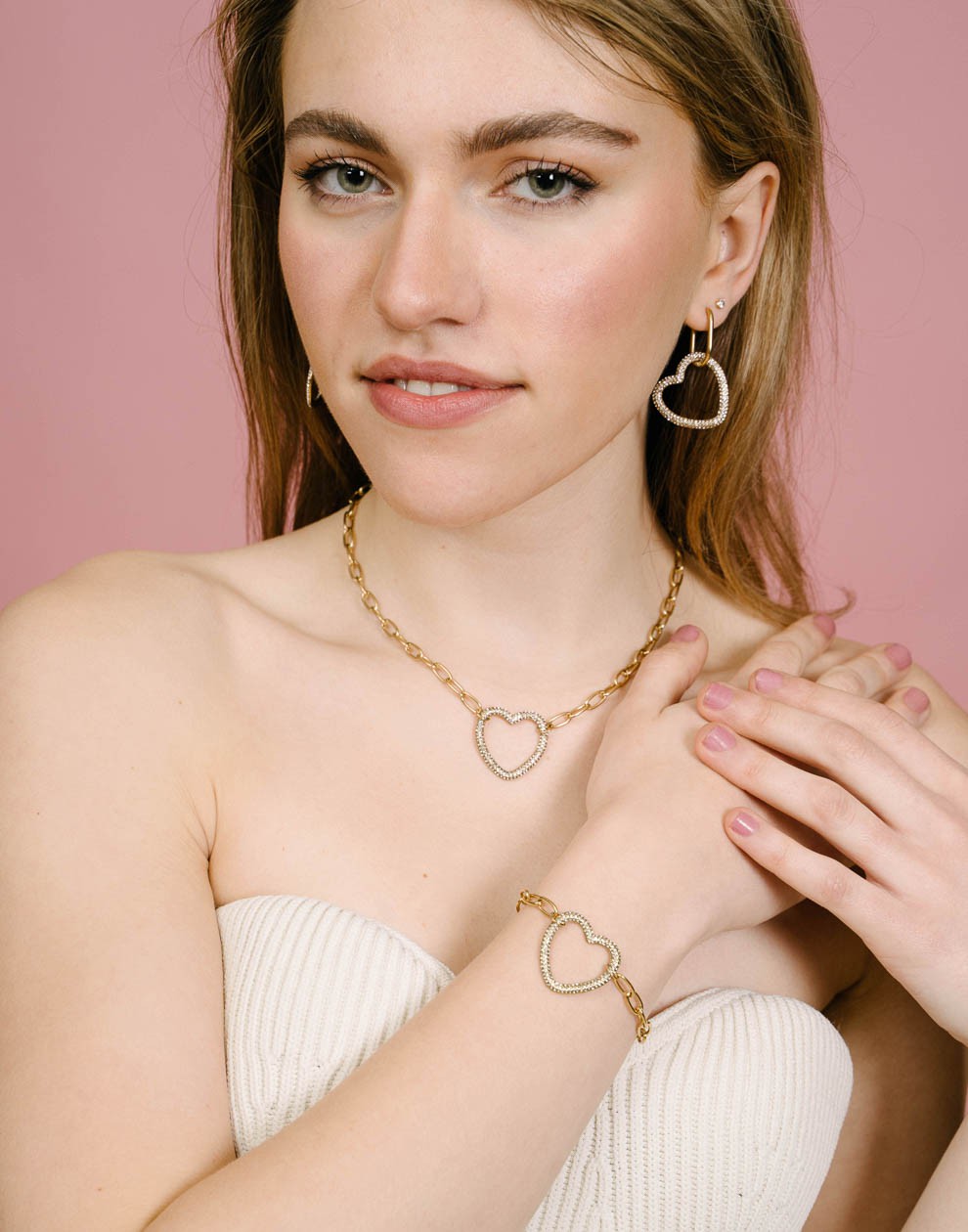 schakelarmband met strass hart goudkleurig