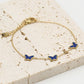 Armband vlinders blauw goudkleurig