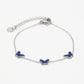 Armband vlinders blauw zilverkleurig