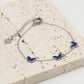 Armband vlinders blauw zilverkleurig