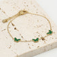 Armband vlinders groen goudkleurig