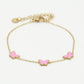 Armband vlinders roze goudkleurig