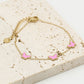 Armband vlinders roze goudkleurig