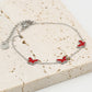Armband vlinders rood zilverkleurig