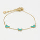 Armband vlinders turquoise goudkleurig