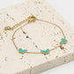 Armband vlinders turquoise goudkleurig