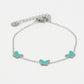 Armband vlinders turquoise zilverkleurig