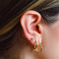 Gold-colored hoop earrings
