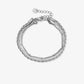 schakelarmband triple zilverkleurig