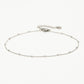 Ankle bracelet with silver-colored beads and links