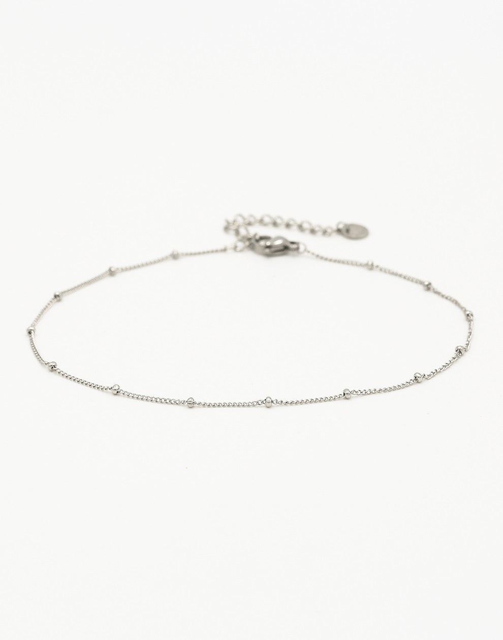 Ankle bracelet with silver-colored beads and links