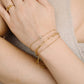 armband kruisje steentjes goudkleurig
