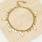 Armband met goudkleurigen muntjes en parels