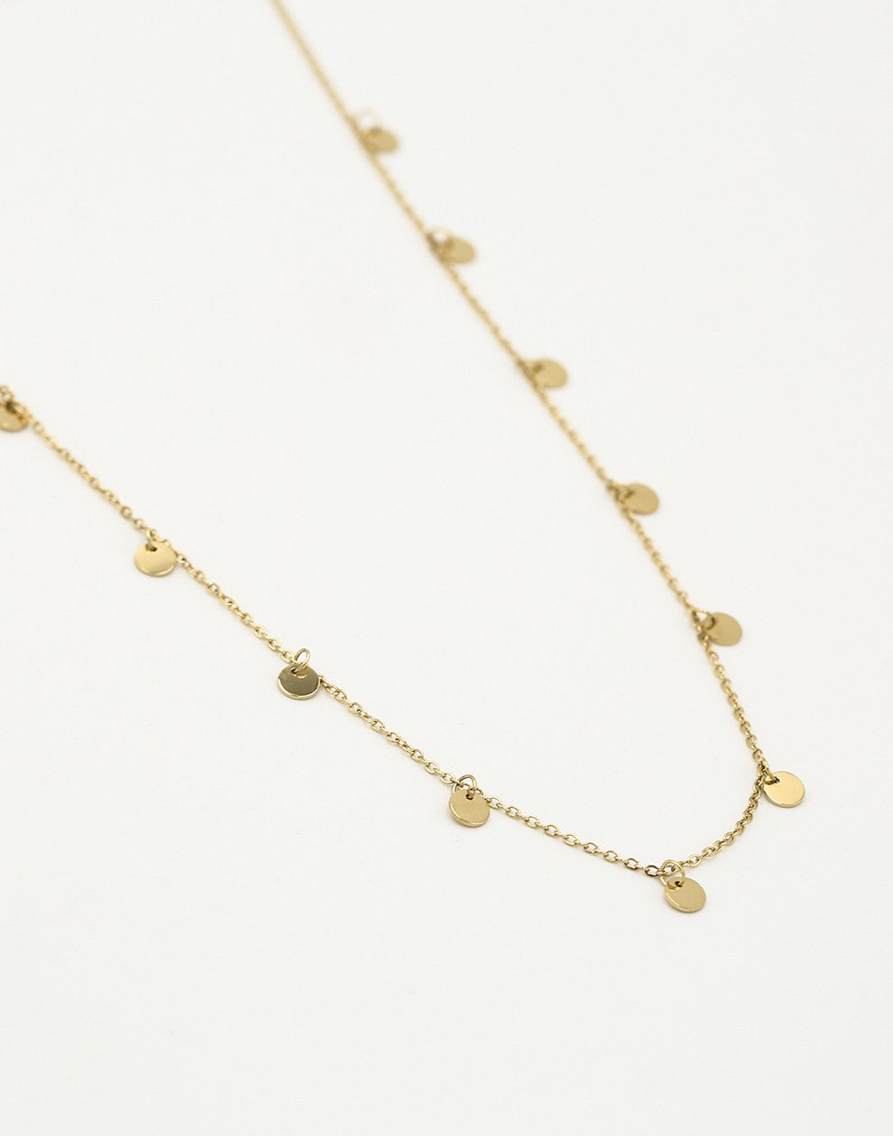Fijne ketting met muntjes 5mm in goudkleurig