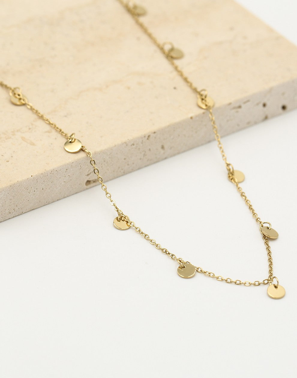 Fijne ketting met muntjes 5mm in goudkleurig