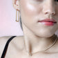 Rectangular gold-colored earrings