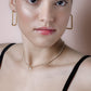 Rectangular gold-colored earrings
