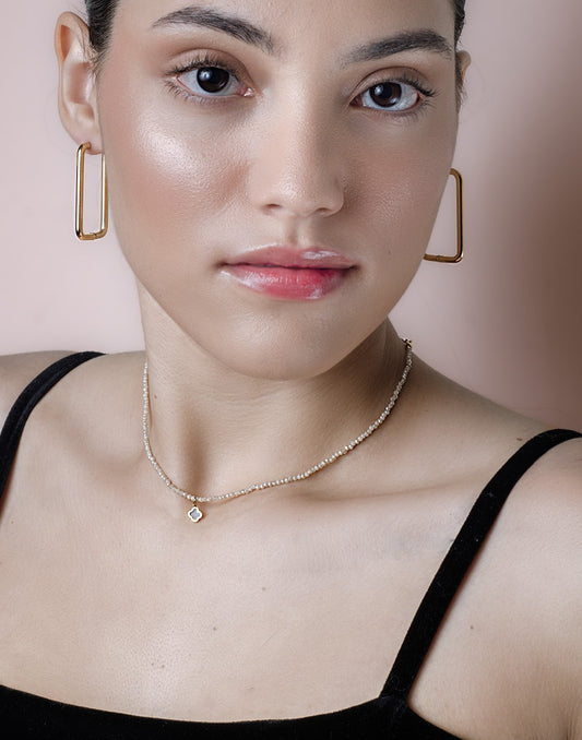 Rectangular gold-colored earrings