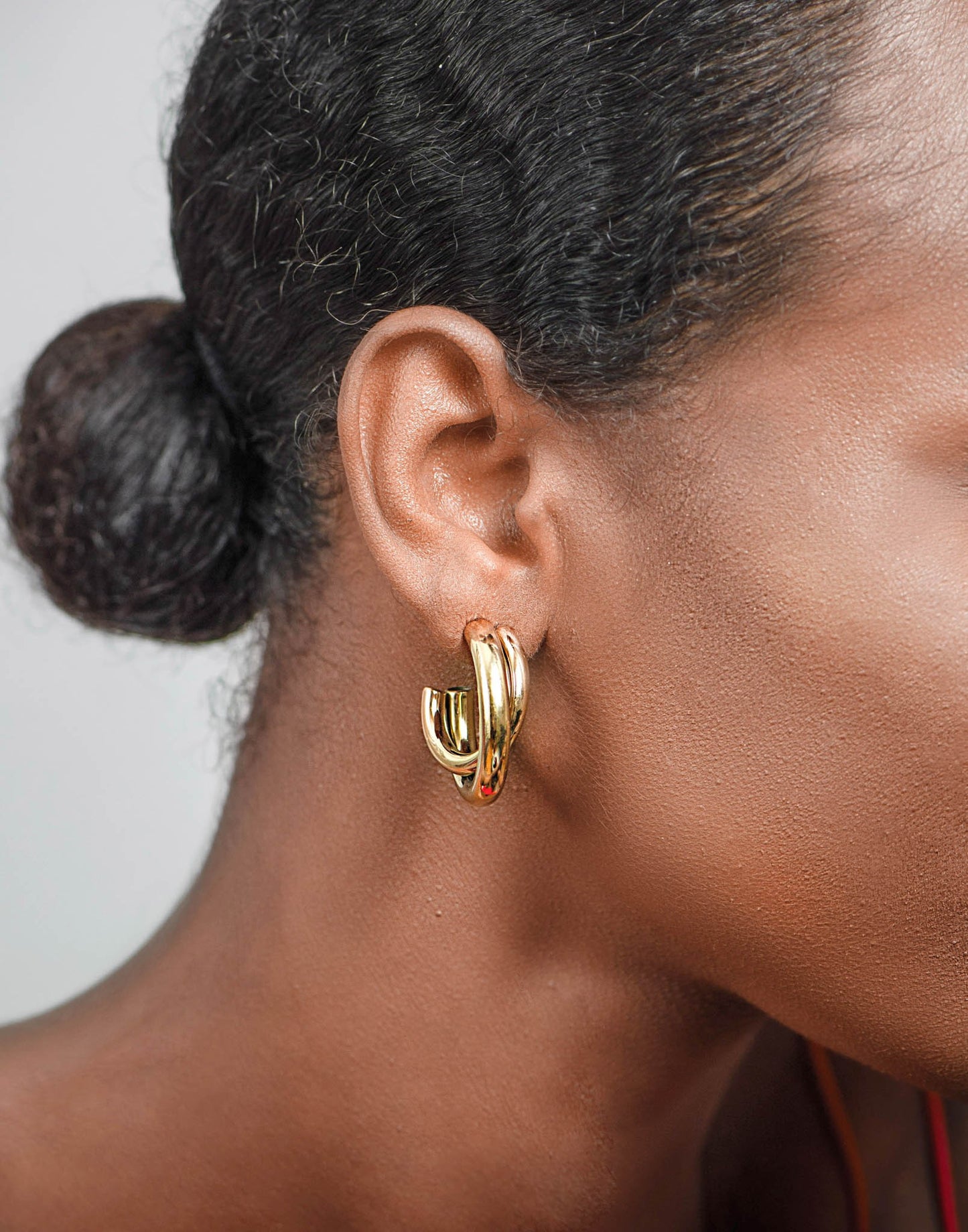 double gold-colored earring